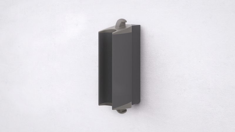 dark gray wall mount attached to a white plaster wall