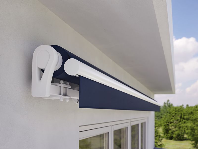 markilux 1300 in white with blue cloth on a white house wall