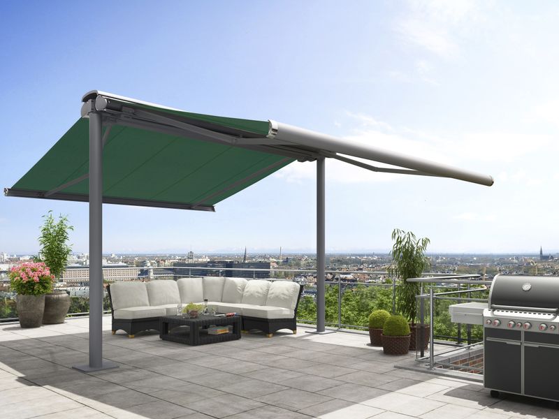 markilux syncra with cassette awnings markilux 6000 with green fabric cover on both sides, installed on a roof terrace in a big city.